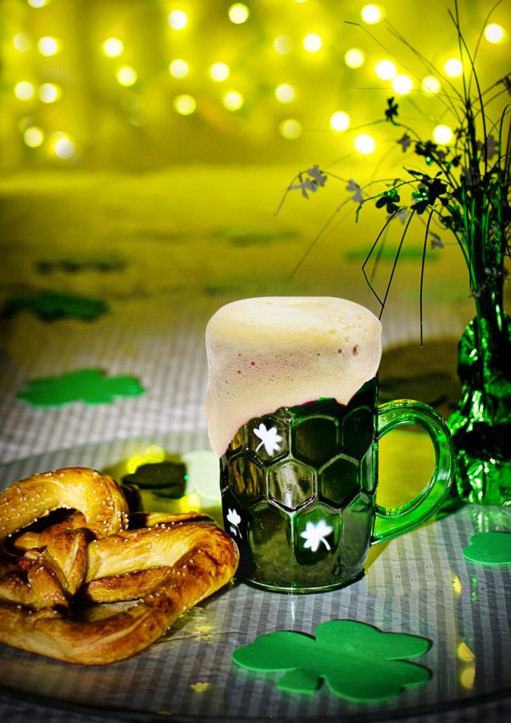 cartoon green beer in a pint glass with other st patricks day decorations